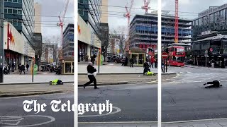 Pedestrians blown over by strong winds as Storm Eunice batters Britain