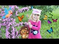 Margo walking in beautiful garden with flowers  Feeds the fish | Kids video