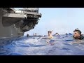 US Sailor Jumps Into Deep Water After Tiring Working Day on Aircraft Carrier