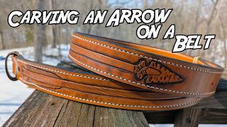 Carving an arrow pattern in a leather belt.  With a name in the center.