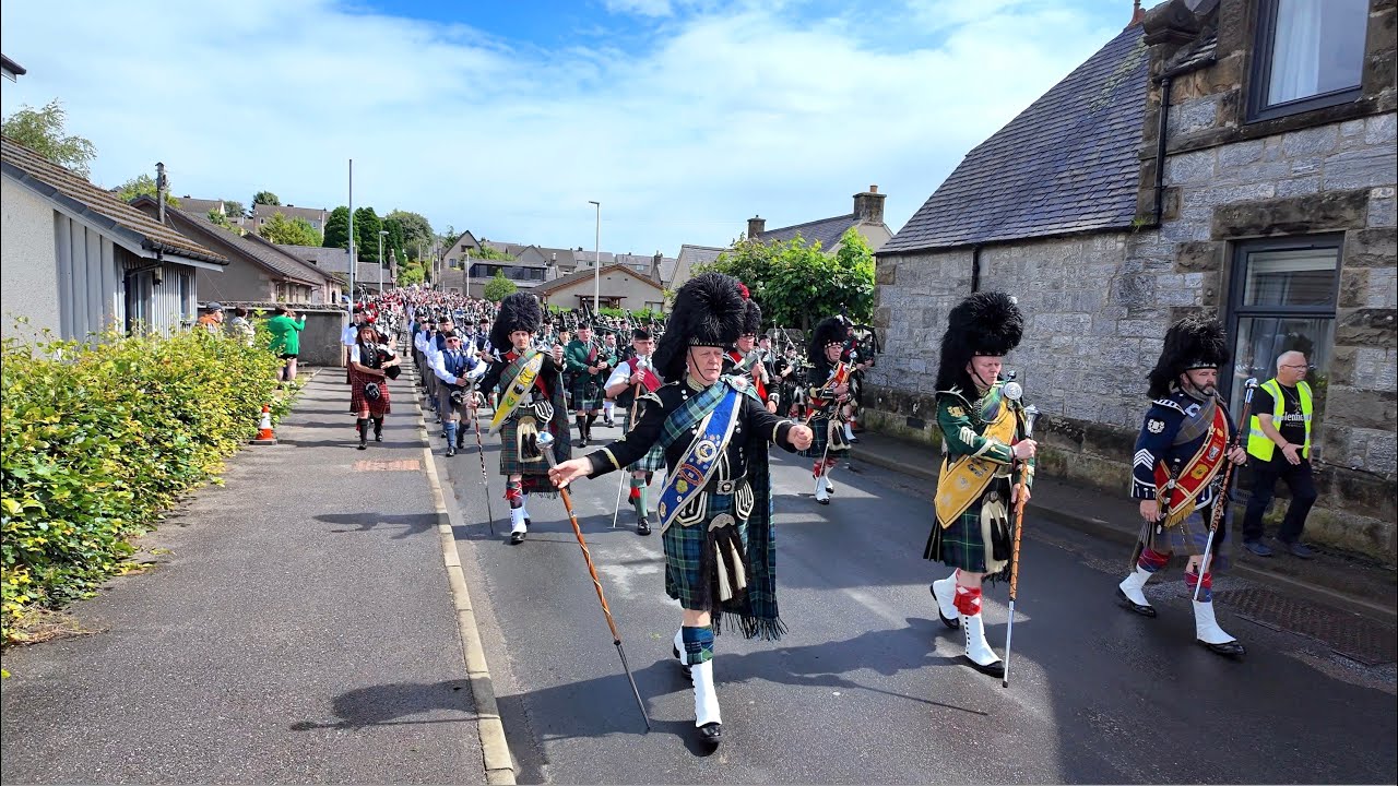 Chieftain leads the march with hundreds of pipers and drummers to 2024 Dufftown Highland Games