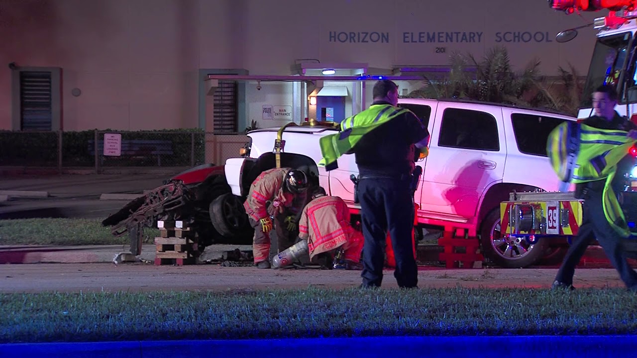 SUV lands on top of Nissan 240 sports car Fire crews extricated driver and airlift to hospital