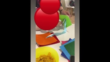 Teaching buttoning using large buttons to develop fine motor skills