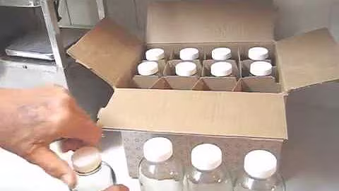 Round new clear glass 16 ounce bottles with NSF approved tops for Norwalk juicer