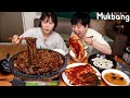 Mukbang  black bean noodles on the stone plate with spicy silvi kimchi