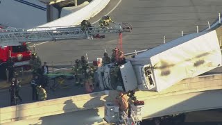 Driver in truck dangling over I-45 North rescued by firefighters