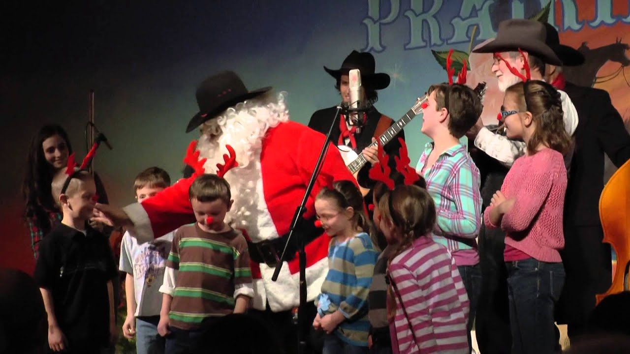 CPE Kids on stage with Santa at the Prairie Rose Chuckwagon Christmas