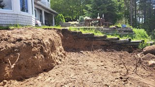 Rock wall job. Building a series of terraced walls.