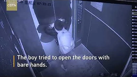 Boy uses umbrella to prevent elevator door from closing causes free fall caught on cam