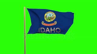 idaho flag with title waving in the wind. Looping sun rises style. Animation loop Stock video by