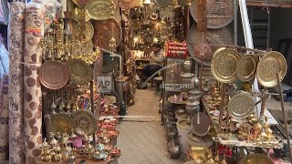 Textile shops take over the coppersmith market in Baghdad as