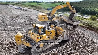 Caterpillar D9T bulldozer at work with a CAT 352 excavator
