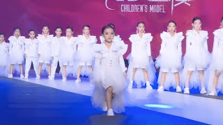 Child models participate in the fashion show as a team-Jiamusi