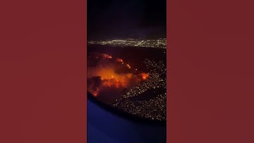 Video from the window of a plane shows the fires burning in Los Angeles on Tues, Jan 7th. We ar