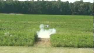 Big log turned into firewood.  Explosive target with slow motion!