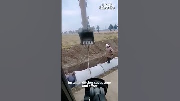 Thumbnail of The crane lifts the round cement pipe to the ditch for installation, saving time and effort