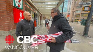 CBC host chats about rain and gives away umbrellas