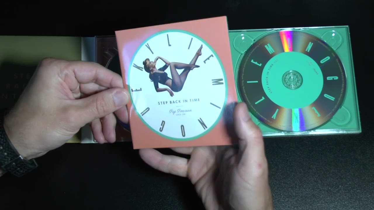 Unpacking and watching Kylie Minogue's CD Is A Step Back In Time. Collection of hits of 2019.