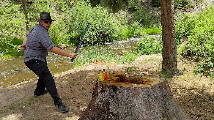 Slow Motion Cut Test - APOC Atrim Broad Sword Cutting Two Short Colored Water Filled Bottles