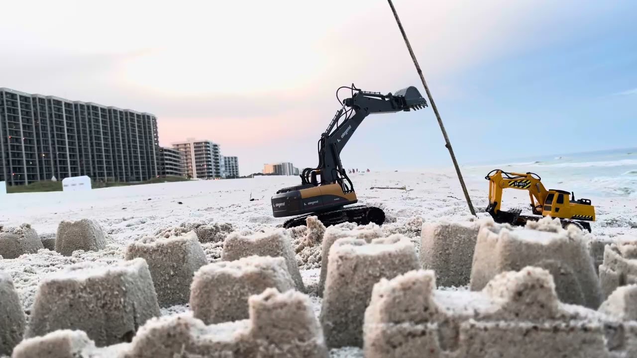 Remote control Excavator destroys sand castles