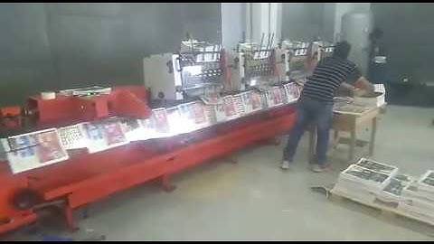 Flowline Stitch Star with 6 auto feeders, inline stitcher and 3 knife trimmer