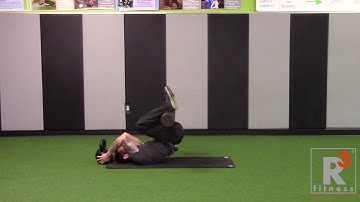 REVERSE CRUNCH W/ FOAM ROLLER HELD BEHIND ANKLES
