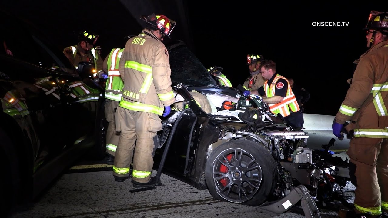 Tesla Driver Trapped After Crashing Into Mazda - YouTube