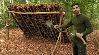 Bushcraft Camp: Building a Super Shelter by hand with Debris and Leaves