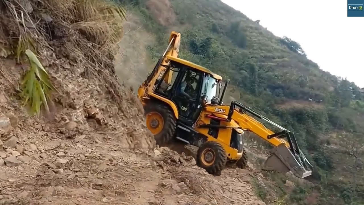 Very Dangerous Rocky Mountain Road Excavation-JCB Backhoe Struggles-Scary Cliff