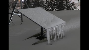 Starlink Dishy in Snowstorm with Ice Buildup