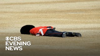 The Queen's Guards try not to faint as temperatures soar