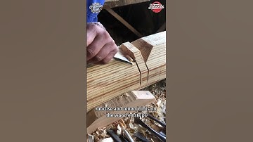 The carpenter used a sharp chisel to carve out mortise and tenon joints on the wooden strips