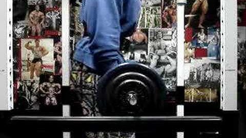 Michael Gundill performs Biceps curls (set 2) with elastic bands