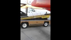 How they transport dead bodies on a plane. 