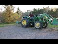 Uprooting trees with jhon deere tractor 5055E