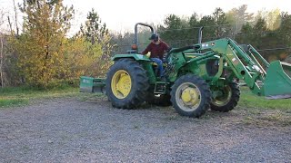 Uprooting trees with jhon deere tractor 5055E