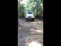 Jeep tears through a mud hole