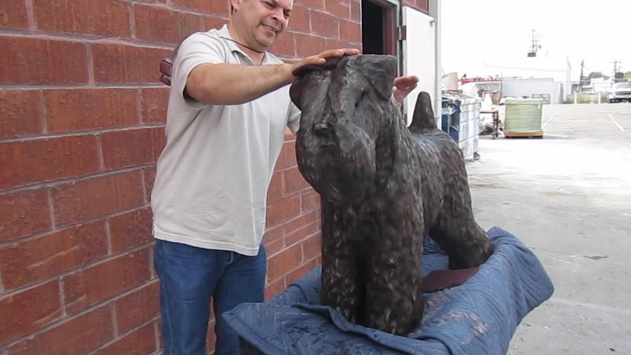 bronze dog sculpture - Adding the highlights to the dog bronze sculpture with a scotch-brite pad