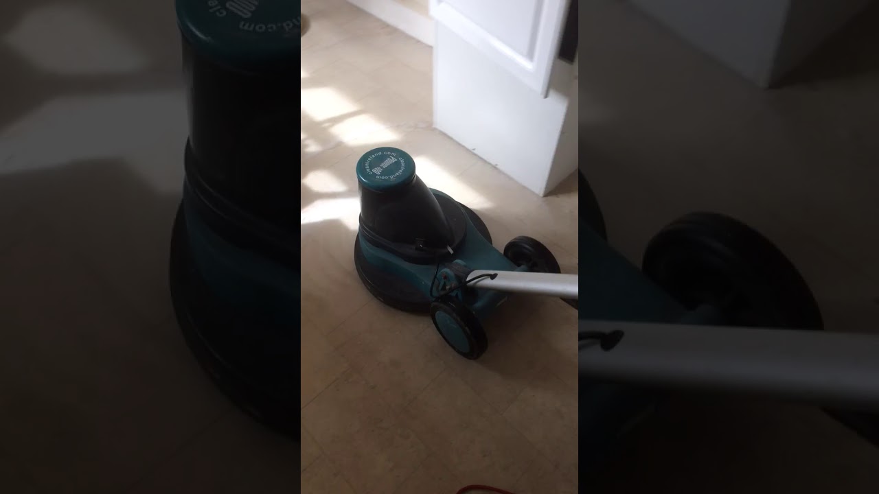 Low speed floor polisher