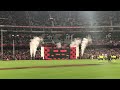 Essendon run onto the MCG for Dreamtime