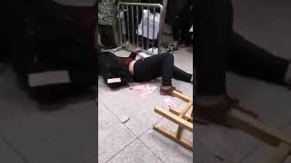 Wuhan? A Man, Collapsed On The Floor, Throws Money By A Queue In A Hospital