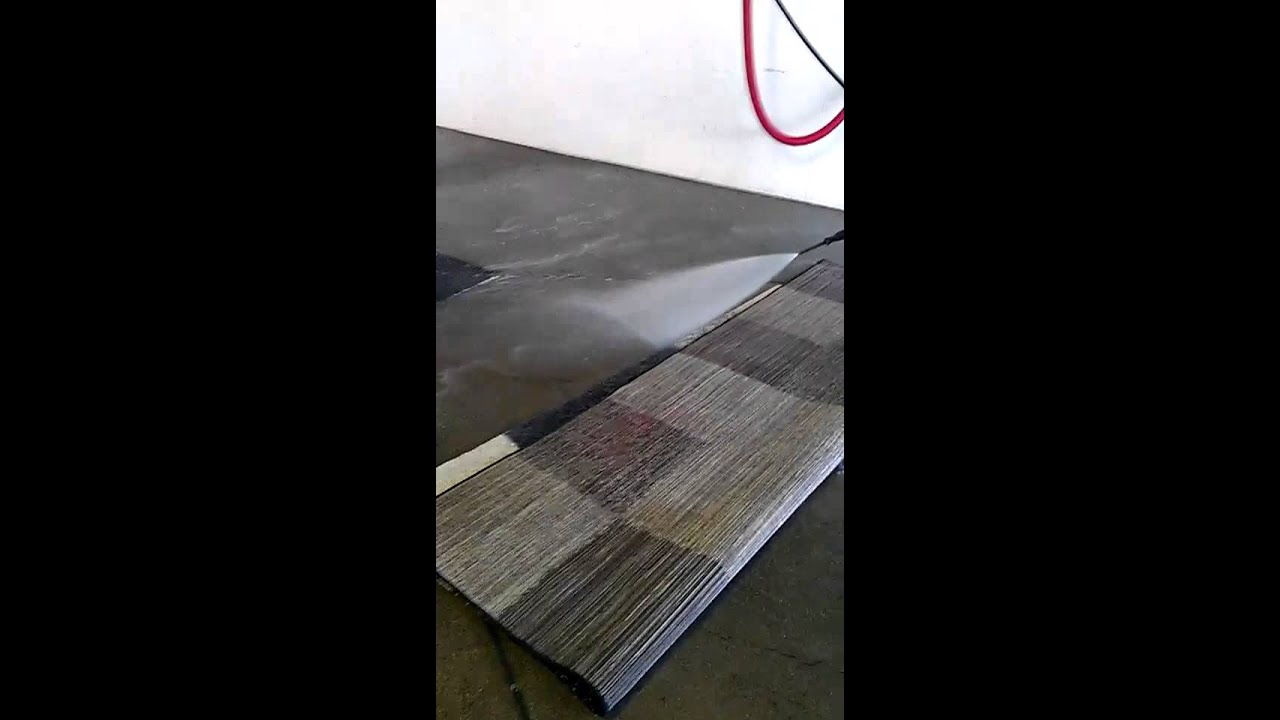 Camerons Cleaning A Rug At Carwash