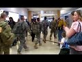 Military troops walks into airport  and this happens  hotvocals