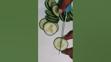 Carving a coconut tree with cucumber .||#fruitcarving #vegcarvingart #creative