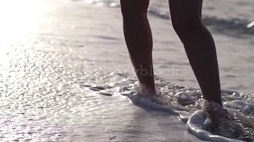 videoblocks bare feet of woman walking along wet sandy beach rakxdawsh  25c0cd7912c3f117b211f4537290