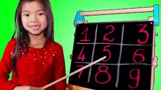 Emma Pretend Play as a Math Teacher