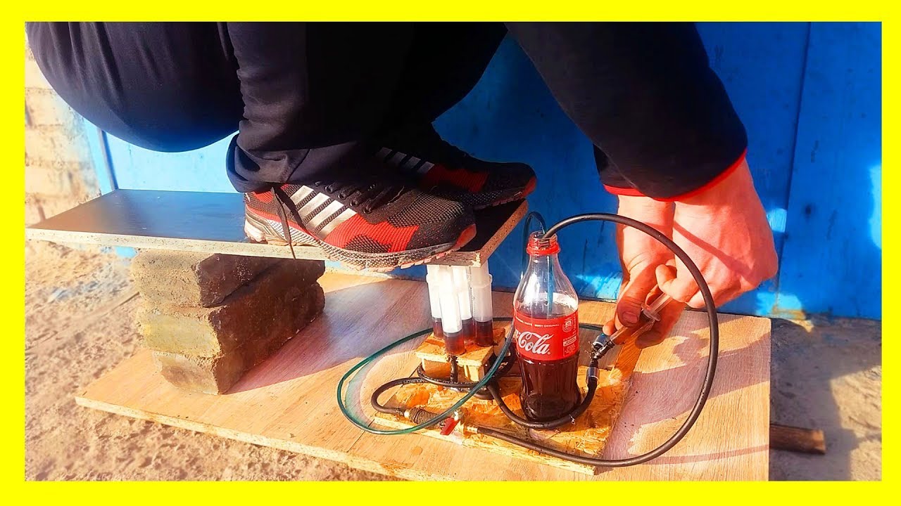 How To Make a Powerful Hydraulic Jack using Coca Cola and a Syringe