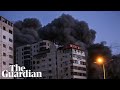 Israeli airstrike collapses tower block and Hamas rocket hits bus as violence escalates