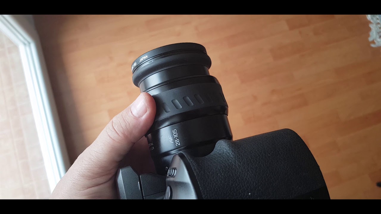 Power Zooming and Manual Focusing Minolta 28-105 xi Lens on Konica