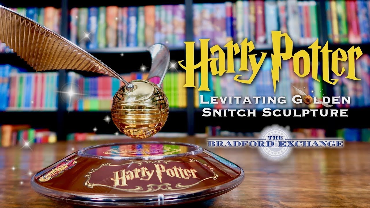 The Harry Potter Levitating Golden Snitch Sculpture with Light Up Base